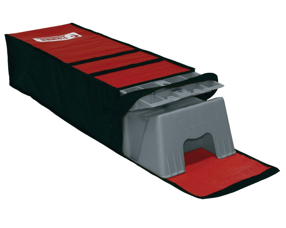 grå nivåklosser pakket i rød bærebag med Fiamma logo i rødt og hvitt